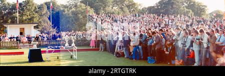 Arthur Edwards ,Sun royal photographer ,next to policeman far right of group 1980  This is a montage of photos and has imperfections Photo has been restored using  AI ,Topaz Pho AI Stock Photo