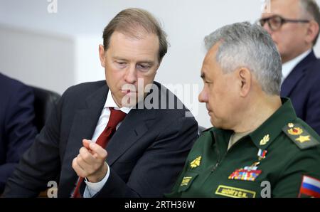 Russian Defense Minister Sergei Shoigu, right, and Deputy Prime Minister and Minister of Trade and Industry Denis Manturov, left, attend the meeting of Russian President Vladimir Putin and North Korea's leader Kim Jong Un on September 13, 2023 at the Vostochny Cosmodrome in Amur region, Russia. The talks between the two leaders could lead to a weapons deal as North Korean leader Kim Jong Un has offered Russian President Vladimir Putin his country's 'unwavering support' for Russia's 'sacred fight'. Kim said that North Korea will 'always stand with Moscow' in its 'fight against imperialism.'. Ph Stock Photo