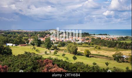 Stunning views of the Norfolk Coast from Incleborough Hill encompassing the lovely little village of West Runton and its links golf course Stock Photo