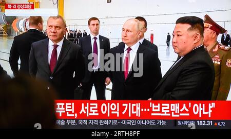 A TV screen shows a report of a meeting between North Korean leader Kim Jong Un and Russian President Vladimir Putin at the Vostochny Cosmodrome space center in Russia's Amur region during a news program at the Yongsan Railway Station in Seoul, South Korea. North Korean leader Kim Jong Un and Russian President Vladimir Putin began their rare talks at Russia's Vostochny space center September 13, according to Russian news media, amid concerns that the two isolated leaders may advance an arms negotiation and bolster military cooperation. Stock Photo