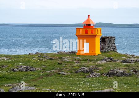 Hafnarnesviti orange lighthouse in Iceland, near Bolungarvik Osholaviti Stock Photo