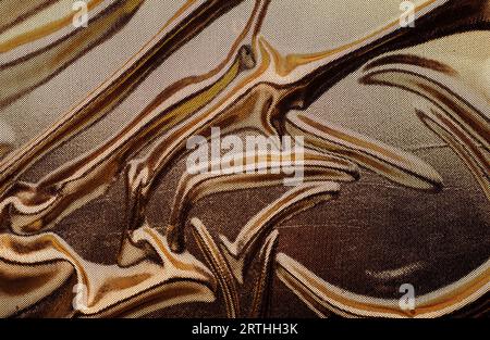 The texture of the fabric. Silk texture. Yellow cloth. Gold cloth. Abstract yellow background. Stock Photo