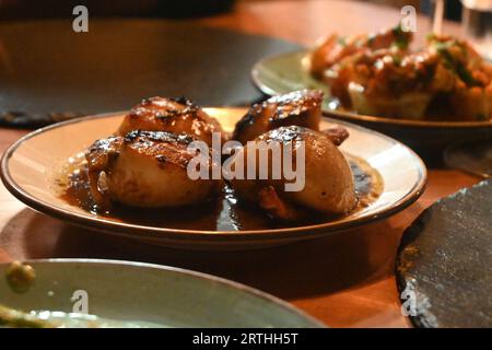 cooked scallops in sauce Stock Photo