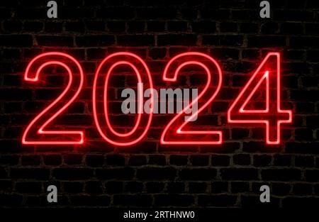 Night image of the number 2024 in red neon text on a brick wall. Concept new year. Stock Photo