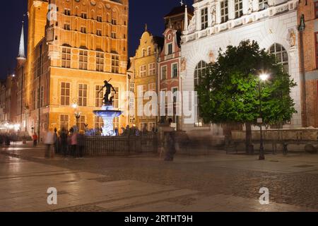 Gdansk by night in Poland, Old Town, Long Market, Town Hall, Artus Court and Neptune Fountain historic city landmarks Stock Photo