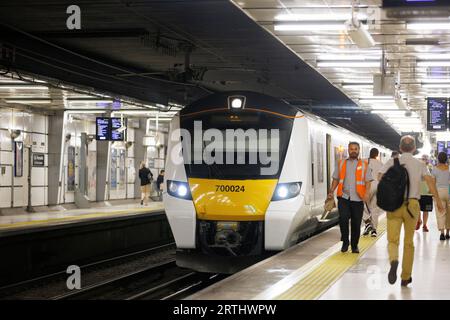 Class 700 passenger train in Thameslink livery at Crawley railway ...