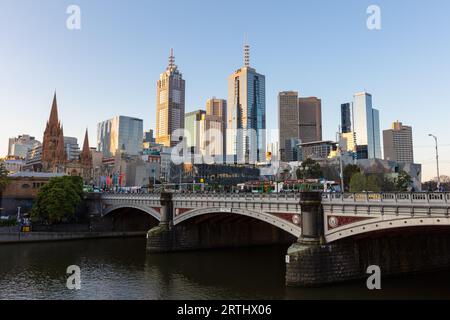 Melbourne's skyline along the Yarra River at sunset towards Federation Square Stock Photo