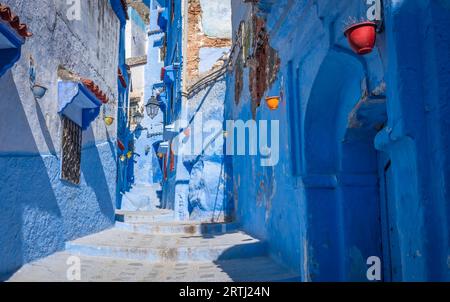 Chefchaouen, Medina in Morocco boasts blue-washed streets and walls with hanging colorful clay pots Stock Photo