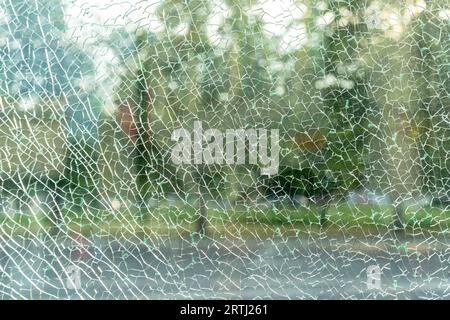 Broken glass. Cracks in the glass. Texture, background shattered glass. Stock Photo