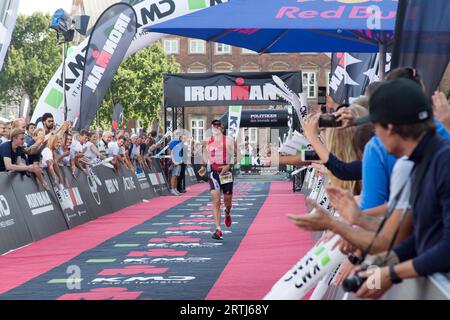 Copenhagen, Denmark, August 21, 2016: Triathlete Fabio Carvalho just before crossing the finish line as 3rd in men's in 08:07:10 at the KMD Ironman Stock Photo