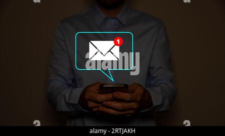 Hand of businessman touching new email notification for business e-mail communication and digital marketing. Inbox receiving electronic message alert. Stock Photo