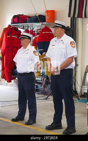 911 commemoration ceremony at Barnstable, MA Fire Headquarters on Cape Cod, USA., Fire Dept Officers at attention Stock Photo