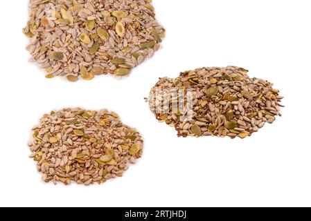 Mix of seeds for a salad. A pile of mixed seeds isolated on a white background. Stock Photo