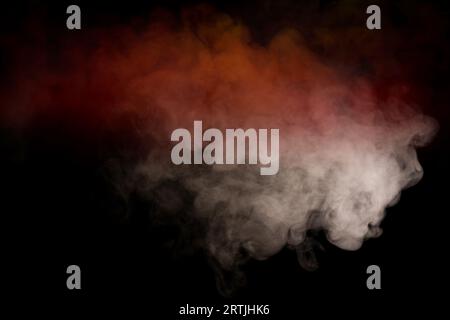 Orange and red steam on a black background. Copy space. Stock Photo