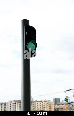 Green traffic light signal in the railway station. Stock Photo