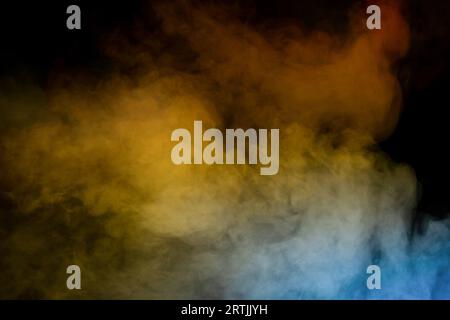Orange and red steam on a black background. Copy space. Stock Photo