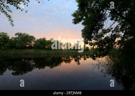 sunset landscape over small river. Take it in Ukraine Stock Photo