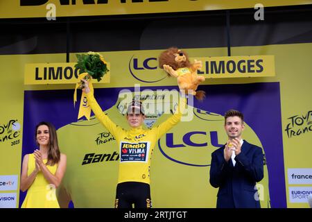 Jonas Vingegaard yellow jersey at the finish of the 8th Libourne Limoges stage of the 2023 cycling Tour de France. Climbing onto the podium in Limoges Stock Photo