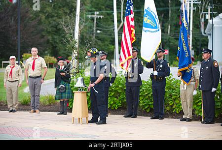 911 commemoration ceremony at Brewster, MA Fire Headquarters on Cape Cod, USA. Sounding the 555-alarm signifying the death of a firefighter Stock Photo
