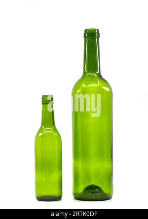 Small empty wine bottle and full size empty wine bottle isolated on a white background. Alcohol consumption concept. Stock Photo