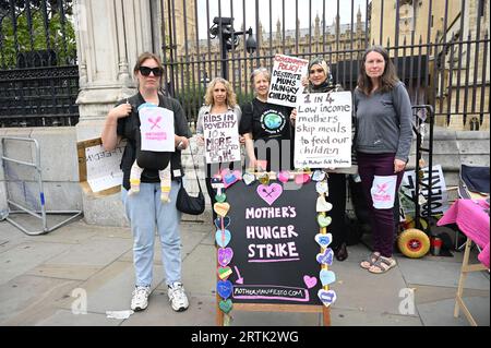 Parliament, London, UK. 13th Sep, 2023. Mothers Manifesto demonstration: 1 in 4 low-income mothers skip meals to feed their children. Also 1 in 4 children in the UK go to school hungry on every Mothers Day. Mothers' Day is a day when mothers who are unable to feed their children go on a hunger strike in unity and solidarity in front of the Parliament. Credit: See Li/Picture Capital/Alamy Live News Stock Photo