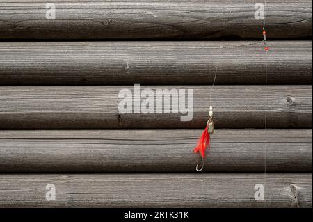 gear for fishing for flatfish on a grey wooden wall Stock Photo