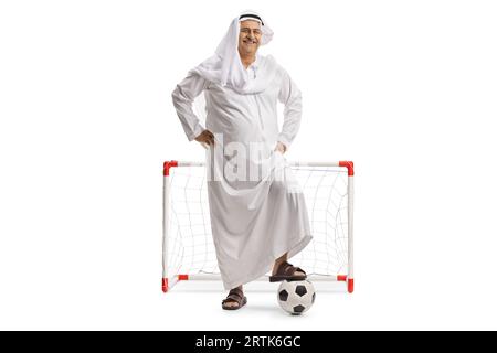 Happy mature arab man with a soccer ball cheering isolated on white ...