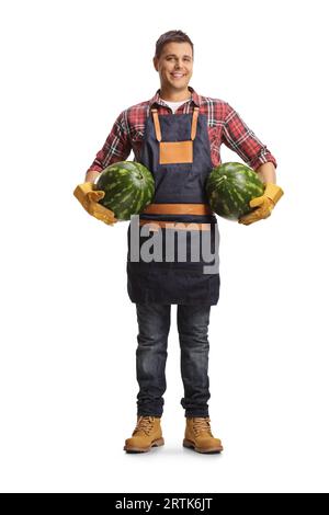Farmer holding two watermelons under arms isolated on white background Stock Photo