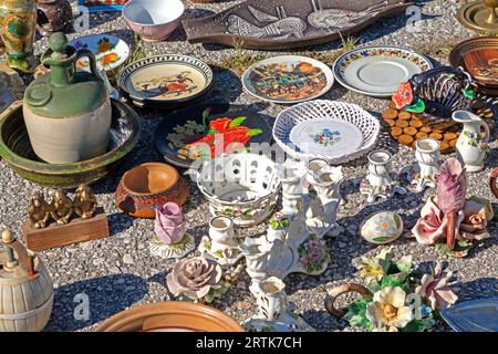 Ceramic and porcelain vintage plates and other tableware sold on flea market Stock Photo