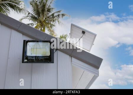 LED bulbs and solar panels in Farmland Solar energy Light Free Energy solar cell power system for all concept Stock Photo