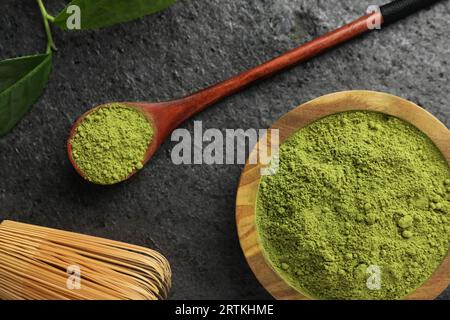 Flat lay composition with green matcha powder on grey table Stock Photo