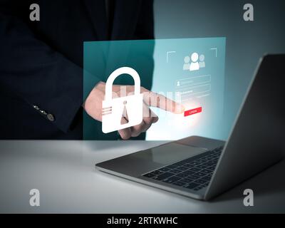 Human hand working on computer and protection icon. Represents the code protection. Security concept and communication technology Stock Photo