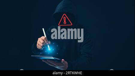 Hackers work on laptops in the dark. The concept of information security in the Internet network and information espionage. Stock Photo