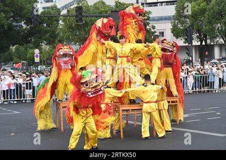 Taizhou, China's Zhejiang Province. 14th Sep, 2023. Lion dancers perform during the torch relay of the 19th Asian Games in Taizhou, east China's Zhejiang Province, Sept. 14, 2023. Credit: Huang Zongzhi/Xinhua/Alamy Live News Stock Photo