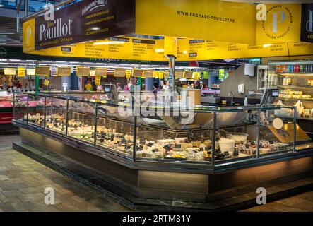 An artesan and traditional cheese stall within the Central Market (Marche des Halles) in Troyes, Aube, France. Stock Photo