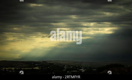 Overcast sky with dark clouds. Dark sky before a thunder-storm. The gray cloud background before rain. Stock Photo