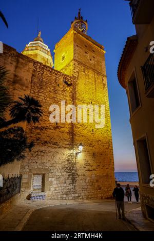 Sea-facing church and street at twilight, Sitges, Catalonia, Spain Stock Photo
