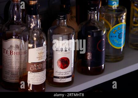 Many bottles of alcohol for cocktail making on a bar at home.  Burgundy. France. Stock Photo