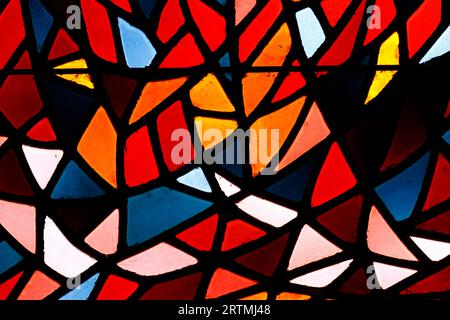 Stained glass window of colored glass.  Saint Nicolas church.  Cluses. France. Stock Photo