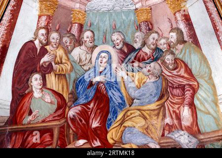 Our Lady Of The Assumption Baroque Church.  The descent of the Holy Spirit upon the Apostles and Virgin Mary. Pentecost. Cordon. France. Stock Photo