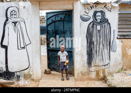 Wall with pictures of mouride muslim spiritual leaders in Fatick, Senegal Stock Photo