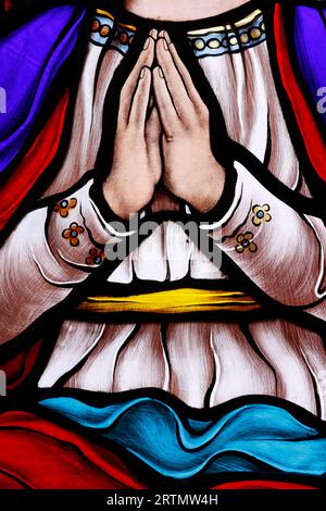 Song Vinh catholic church.  Stained glass window.  Virgin Mary praying.  Vietnam. Stock Photo