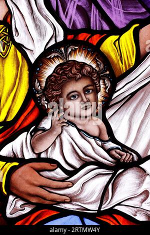 Song Vinh catholic church.  Stained glass window. Infant Jesus.  Vietnam. Stock Photo