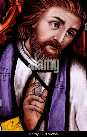 Song Vinh catholic church.  Stained glass window.  Priest blessing.  Vietnam. Stock Photo