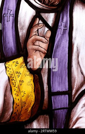 Song Vinh catholic church.  Stained glass window.  Priest blessing.  Vietnam. Stock Photo