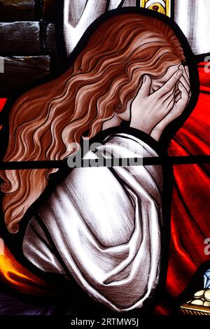 Song Vinh catholic church.  Stained glass window.  Woman  praying.  Vietnam. Stock Photo