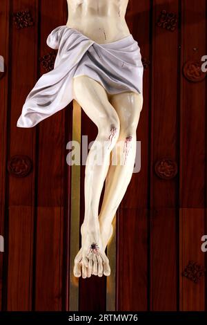 Song Vinh catholic church.  The crucifixion. Jesus on the cross. Detail on legs.  Vietnam. Stock Photo