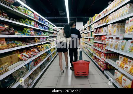 Couple shopping in a supermarket. Vung Tau. Vietnam. Stock Photo