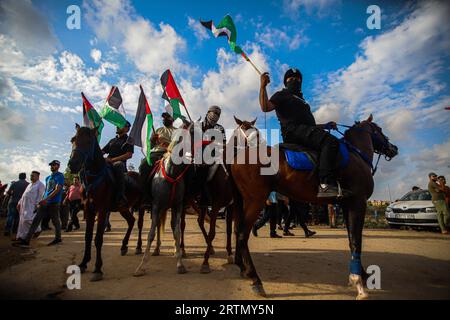 Palestine. 13th Sep, 2023. Palestinian protesters gather during a demonstration along the border fence with Israel, east of Gaza City, to mark Israel's withdrawal from the Gaza Strip in 2005, on September 13, 2023. At least six Palestinians were killed Wednesday afternoon after an explosive device they attempted to detonate on the Israeli border during a riot blew up prematurely, the military and health officials in the Gaza Strip said. Photo by Ramez Habboub/ABACAPRESS.COM Credit: Abaca Press/Alamy Live News Stock Photo