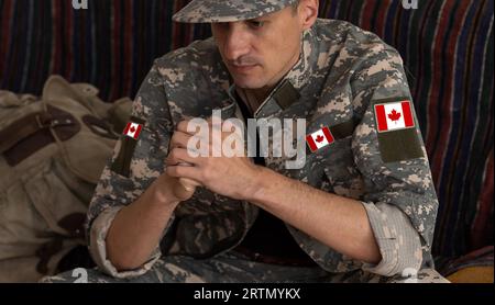 Flag of Canada on military uniform. Canadian soldiers. Army of Canada. Remembrance Day. Canada Day Stock Photo